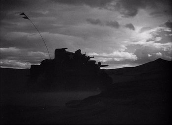 Movie still from “Sahara” (1943), directed by Zoltan Korda – A black and white photo of a tank in the desert; Extreme Wide shot, Low angle