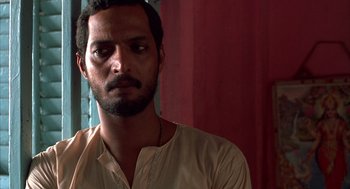 Movie still from “Salaam Bombay!” (1988), directed by Mira Nair – A person wearing a shirt; Close Up shot, Low angle