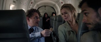 Movie still from “Salt and Fire” (2016), directed by Werner Herzog – A man and a woman sitting on a plane; Medium shot, Over the shoulder angle