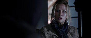 Movie still from “Salt and Fire” (2016), directed by Werner Herzog – A person wearing a jacket and a scarf; Close Up shot, Over the shoulder angle