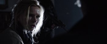 Movie still from “Salt and Fire” (2016), directed by Werner Herzog – A woman with blond hair is looking at the camera; Close Up shot, Low angle