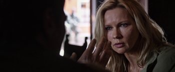 Movie still from “Salt and Fire” (2016), directed by Werner Herzog – A person with a hand on their face; Close Up shot, Over the shoulder angle