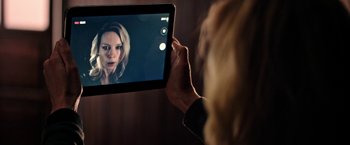 Movie still from “Salt and Fire” (2016), directed by Werner Herzog – A woman holding a tablet in front of her face; Close Up shot, Over the shoulder angle