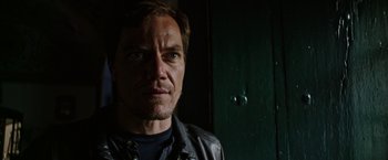 Movie still from “Salt and Fire” (2016), directed by Werner Herzog – A person wearing a leather jacket; Close Up shot, Low angle