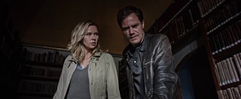 Movie still from “Salt and Fire” (2016), directed by Werner Herzog – A man and a woman standing next to each other; Medium shot, Low angle