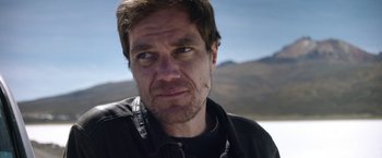 Movie still from “Salt and Fire” (2016), directed by Werner Herzog – A person wearing a black jacket; Close Up shot, Over the shoulder angle