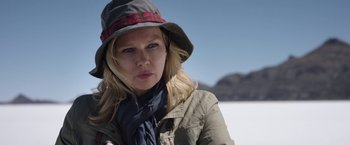 Movie still from “Salt and Fire” (2016), directed by Werner Herzog – A woman wearing a hat in the snow; Close Up shot, Over the shoulder angle