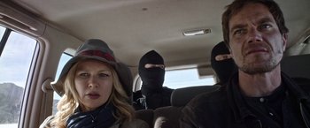 Movie still from “Salt and Fire” (2016), directed by Werner Herzog – A woman and two men in balaclavas in the back of a car; Close Up shot, Over the shoulder angle
