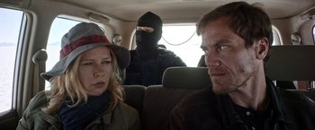 Movie still from “Salt and Fire” (2016), directed by Werner Herzog – A man and a woman in the back of a car; Close Up shot, Over the shoulder angle