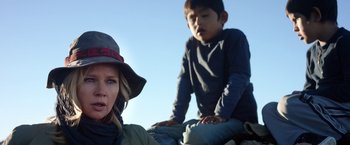 Movie still from “Salt and Fire” (2016), directed by Werner Herzog – A woman and a boy sitting on top of a hill; Close Up shot, Over the shoulder angle