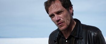 Movie still from “Salt and Fire” (2016), directed by Werner Herzog – A person wearing a black shirt; Close Up shot, Low angle