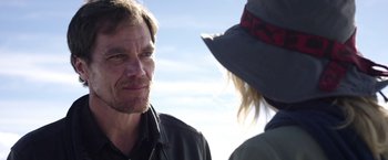 Movie still from “Salt and Fire” (2016), directed by Werner Herzog – A man and a woman are talking outside; Close Up shot, Over the shoulder angle