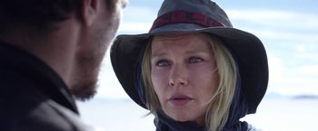 Movie still from “Salt and Fire” (2016), directed by Werner Herzog – A person wearing a hat; Close Up shot, Over the shoulder angle