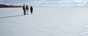 Movie still from “Salt and Fire” (2016), directed by Werner Herzog – Two people are standing in the middle of the desert; Extreme Wide shot, High angle