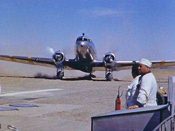 Movie still from “Saludos Amigos” (1942), directed by Jack Kinney – An airplane is about to take off from the runway; Extreme Wide shot, Low angle