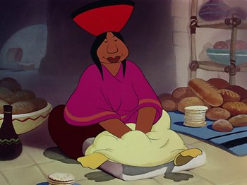 Movie still from “Saludos Amigos” (1942), directed by Jack Kinney – An animated woman sitting on the floor in front of some food; Medium shot, Over the shoulder angle