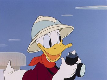 Movie still from “Saludos Amigos” (1942), directed by Jack Kinney – A painting of donald duck holding a camera and taking a picture; Close Up shot, Low angle