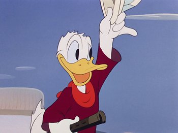 Movie still from “Saludos Amigos” (1942), directed by Jack Kinney – A cartoon of donald duck holding up a piece of paper in the air; Medium shot, Low angle