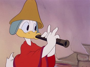 Movie still from “Saludos Amigos” (1942), directed by Jack Kinney – A cartoon character holding a flute; Close Up shot, High angle