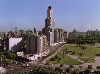 Movie still from “Saludos Amigos” (1942), directed by Jack Kinney – An aerial view of a large city with tall buildings; Extreme Wide shot, High angle