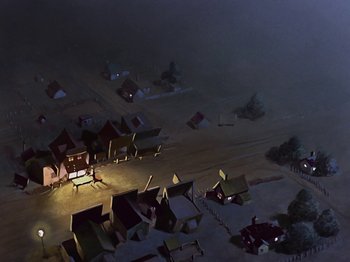 Movie still from “Saludos Amigos” (1942), directed by Jack Kinney – An aerial view of a town at night with lights on; Extreme Wide shot, High angle