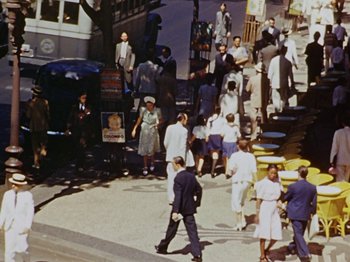 Movie still from “Saludos Amigos” (1942), directed by Jack Kinney – A crowd of people walking down a street; Extreme Wide shot, High angle