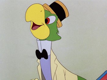 Movie still from “Saludos Amigos” (1942), directed by Jack Kinney – A cartoon bird wearing a top hat and holding a knife; Close Up shot, Low angle