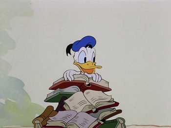 Movie still from “Saludos Amigos” (1942), directed by Jack Kinney – A drawing of a cartoon duck sitting on top of a pile of books; Medium shot, High angle