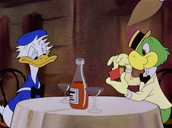 Movie still from “Saludos Amigos” (1942), directed by Jack Kinney – A couple of cartoon characters sitting at a table with drinks; Medium shot, Over the shoulder angle