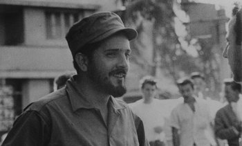 Movie still from “Salut les Cubains” (1963), directed by Agnès Varda – A man with a beard wearing a hat and smiling; Close Up shot, Low angle