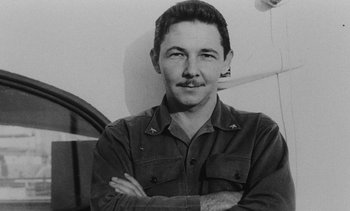 Movie still from “Salut les Cubains” (1963), directed by Agnès Varda – A man with a mustache is posing for a picture; Close Up shot, High angle