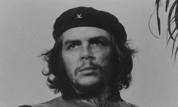 Movie still from “Salut les Cubains” (1963), directed by Agnès Varda – A man with long hair wearing a black hat; Close Up shot, Low angle