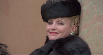 Movie still from “Salò, or the 120 Days of Sodom” (1975), directed by Pier Paolo Pasolini – A woman wearing a fur coat and a fur hat; Close Up shot, Low angle