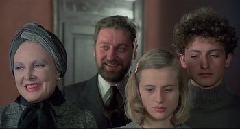 Movie still from “Salò, or the 120 Days of Sodom” (1975), directed by Pier Paolo Pasolini – A group of people standing next to each other in a room; Close Up shot, Over the shoulder angle