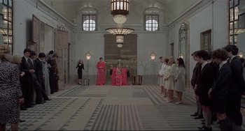 Movie still from “Salò, or the 120 Days of Sodom” (1975), directed by Pier Paolo Pasolini – A group of people standing in a large room; Extreme Wide shot, High angle