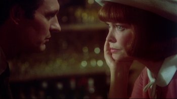 Movie still from “Same Time, Next Year” (1978), directed by Robert Mulligan – A man and a woman looking at one another; Close Up shot, Over the shoulder angle