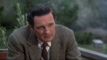 Movie still from “Same Time, Next Year” (1978), directed by Robert Mulligan – A person wearing a suit and tie; Close Up shot, High angle