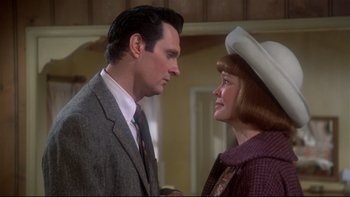 Movie still from “Same Time, Next Year” (1978), directed by Robert Mulligan – A man and a woman standing next to each other; Close Up shot, Over the shoulder angle