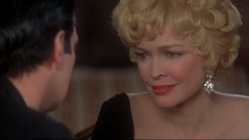 Movie still from “Same Time, Next Year” (1978), directed by Robert Mulligan – An older woman sitting in front of a younger man; Close Up shot, Over the shoulder angle