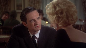 Movie still from “Same Time, Next Year” (1978), directed by Robert Mulligan – A man and a woman are talking to each other; Close Up shot, Over the shoulder angle