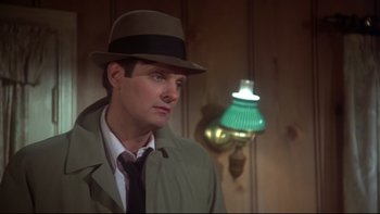 Movie still from “Same Time, Next Year” (1978), directed by Robert Mulligan – A man wearing a hat and a coat; Close Up shot, Low angle