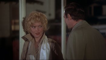 Movie still from “Same Time, Next Year” (1978), directed by Robert Mulligan – A man and a woman standing next to each other; Medium shot, Over the shoulder angle