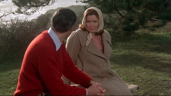 Movie still from “Same Time, Next Year” (1978), directed by Robert Mulligan – A man and a woman sitting on a bench in a park; Medium shot, Over the shoulder angle