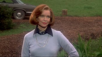 Movie still from “Same Time, Next Year” (1978), directed by Robert Mulligan – A woman in a blue sweater and a necklace; Medium shot, Low angle