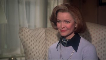 Movie still from “Same Time, Next Year” (1978), directed by Robert Mulligan – A person sitting on a chair; Close Up shot, Over the shoulder angle