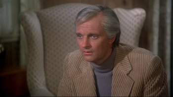 Movie still from “Same Time, Next Year” (1978), directed by Robert Mulligan – A person sitting on a couch; Close Up shot, High angle