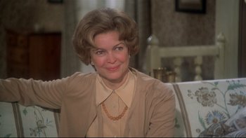 Movie still from “Same Time, Next Year” (1978), directed by Robert Mulligan – A person sitting on a chair; Close Up shot, Over the shoulder angle