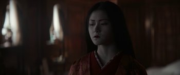 Movie still from “1899” (2022), created by Jantje Friese – A young woman in a red kimono is looking down; Close Up shot, Over the shoulder angle