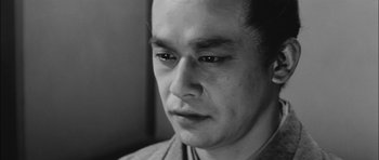 Movie still from “Samurai Rebellion” (1967), directed by Masaki Kobayashi – A person looking at the camera; Close Up shot, Low angle