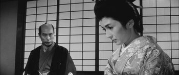 Movie still from “Samurai Rebellion” (1967), directed by Masaki Kobayashi – A man and a woman in traditional japanese clothing; Close Up shot, Over the shoulder angle